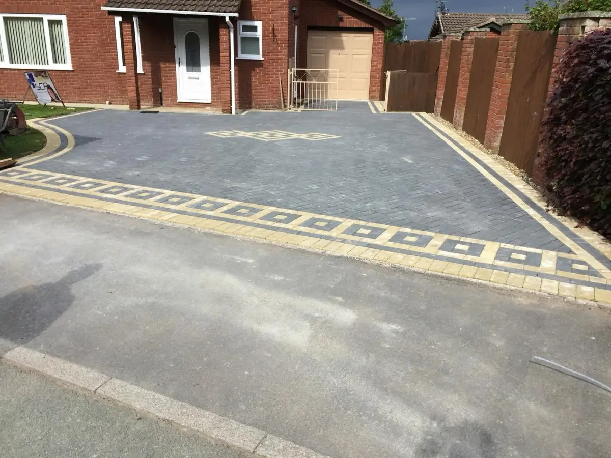 Modern block paving driveway with grey and cream pattern